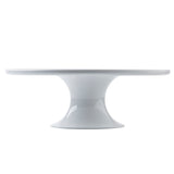 A glossy white melamine cake stand with a wide, flat top and a sturdy, flared pedestal base. Part of the Crofthouse Collection, its minimalist design features clean lines and a smooth finish, shown against a plain white background.