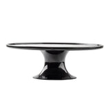 A glossy black ceramic cake stand from the Crofthouse Collection features a wide, flat top and flared pedestal base. Its smooth, shiny surface and minimalist design are showcased on a plain white background.