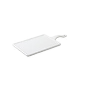 Rectangular white ceramic serving paddle with a textured surface, rounded edges, and a handle featuring a small hole for hanging. The board is photographed on a white background with a slight shadow beneath it.