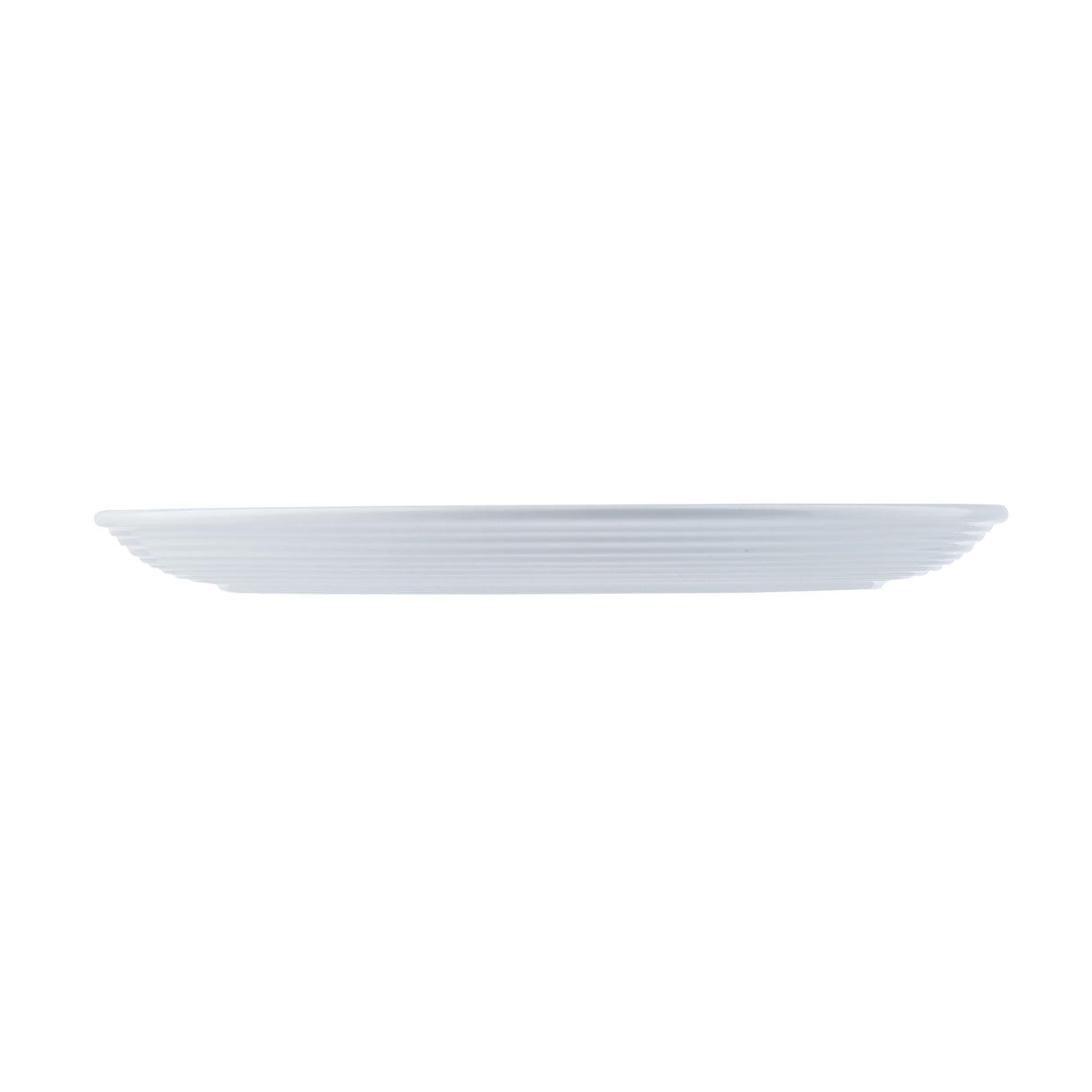 A white, round, flat melamine plate from the TableCraft Pulito Collection is shown from the side against a plain white background. The plate has a smooth surface with subtle, evenly spaced horizontal ridges along its edge.