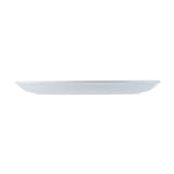 A white, round, flat melamine plate from the TableCraft Pulito Collection is shown from the side against a plain white background. The plate has a smooth surface with subtle, evenly spaced horizontal ridges along its edge.