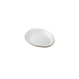 A small, oval-shaped white melamine serving plate with a slightly uneven surface and a thin, light beige rim, placed on a plain white background. The plate appears minimalist and handmade.