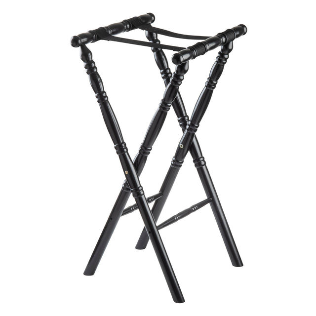 A black rubberwood folding luggage rack with a classic spindle design, featuring four turned legs, two crossed support straps on top, and decorative grooves along the legs. The rack stands open and upright on a white background.