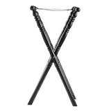 A black rubberwood folding luggage rack with two X-shaped legs, decorative carved details, and two parallel black support straps across the top for holding suitcases or bags. The rack stands on a white background.