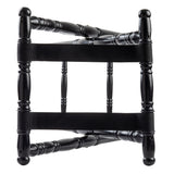 A black rubberwood chair viewed from above, featuring four legs with decorative turned spindle design and two wide black straps stretched across the seat area instead of a traditional chair seat.