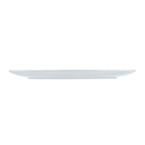 A white, empty, round ceramic plate from the Sierra Collection Serving Platter range is viewed from the side, showing its thin, flat profile against a plain white background.
