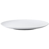 A plain, round white ceramic serving platter with a smooth surface and slightly raised edges, shown from a slight angle against a white background. The platter is empty and features a simple, minimalist design.