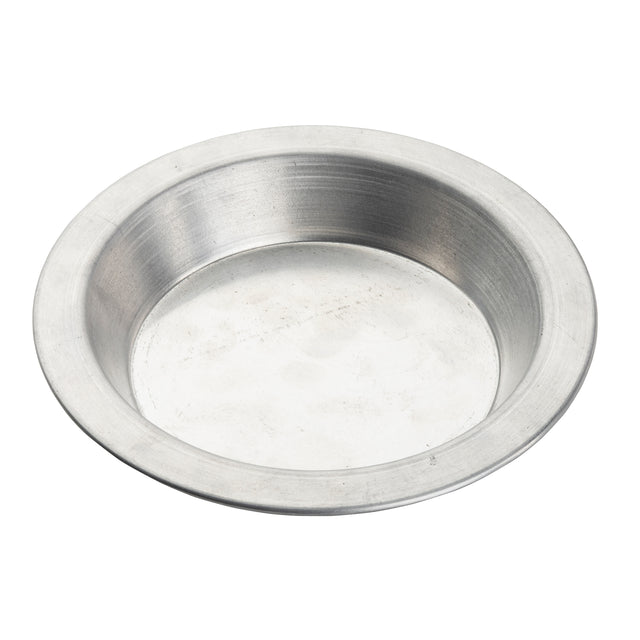 A 6 inch, round, shallow aluminum dish with a smooth, slightly reflective surface. This pie pan server has a wide, flat rim and appears empty, photographed on a white background to highlight its plain, utilitarian design.