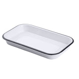 A white rectangular enamel baking dish with rounded corners, inspired by the Canteen Collection Sheet Pan, features a slightly raised black rim and smooth, glossy surfaces. Shown empty against a plain white background with shallow sides.