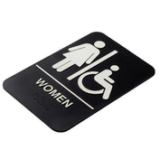 A TableCraft 11673 black polystyrene women accessible sign features white symbols of a standing woman and a person in a wheelchair, separated by a line. "WOMEN" is printed below with Braille dots, and the sign has rounded corners.
