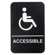 A black rectangular accessible sign with a white wheelchair symbol above "ACCESSIBLE" in bold capitals. The polystyrene sign also features braille beneath the text for visually impaired accessibility.