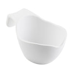 White ceramic sauce boat with a wide, rounded shape and an extended flat handle on one side, photographed on a plain white background. The handle curves upward for easy gripping, and the bowl has smooth, slightly irregular edges.