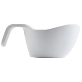 A white, modern, minimalist melamine measuring cup with a curved handle extending horizontally. The cup has smooth sides and a spout for easy pouring, is dishwasher safe, and is photographed on a plain white background.