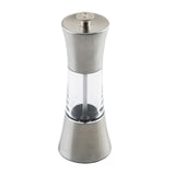 A modern hourglass-shaped TableCraft Salt & Pepper Mill featuring stainless steel top and base, with a clear acrylic center that displays the grinding mechanism and contents. Simply press the top button to grind your spices with style.