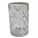 A clear glass mixing beaker from the TableCraft Waverly Collection features a wide, cylindrical shape, diamond-patterned texture, and a small spout near the rim for pouring. This elegant mixing glass sits empty on a white background.