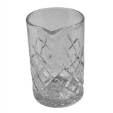 A clear TableCraft Mixing Glass from the Waverly Collection, featuring a textured, crisscross diamond pattern and a pour spout. The cylindrical glass is transparent, with light reflecting off its patterned surface against a plain white background.