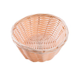 A round, light brown hand-woven basket with a woven pattern. The basket features an open top, slightly flared sides, and a solid circular base. It is empty and set against a plain white background.