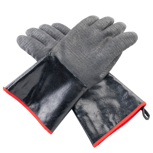 Two black industrial safety gloves with textured gray fingers and palms, shiny black cuffs, and red trim. These TableCraft high heat gloves are crossed with palms facing up, and feature a small loop on one cuff for easy hanging. White background.