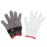 Two gloves are side by side on a white surface: the left is a gray stainless steel protective glove with a black strap and snap button at the wrist, the right is a white fabric glove with red trim. Both have five fingers and are shown palm up.