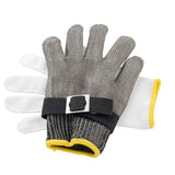 Two gloves are shown: a white fabric glove with yellow trim, and a stainless steel cut-resistant glove with a black strap and buckle. The metal protective glove is placed on top of the white glove, both positioned palm down on a white background.