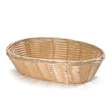 An empty, oval-shaped, light-brown hand-woven basket with a woven pattern sits on a plain white background. The basket’s sides are slightly flared out and the texture of the interlaced wicker strips is clearly visible.