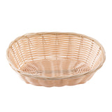 A round, shallow hand-woven basket with an open weave pattern and a smooth, light beige color. The basket’s rim is slightly thicker, and its surface has a gentle shine, indicating it is clean and empty.