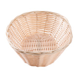 A round, empty hand-woven basket with light beige woven strips. The wide opening, slightly flared sides, and crisscross weave pattern with visible gaps give it a charming look. The background is plain white.