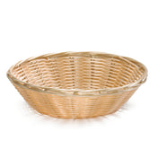 A shallow, round wicker basket made of light tan woven materials and hand-woven with a simple crisscross pattern. The basket features a smooth, raised rim and is shown empty against a white background.