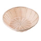 A round, shallow hand-woven basket made of light-colored woven reeds. The basket features a slightly raised rim and an open, airy pattern, with concentric circles at the base and a uniform, smooth texture throughout. The background is plain white.
