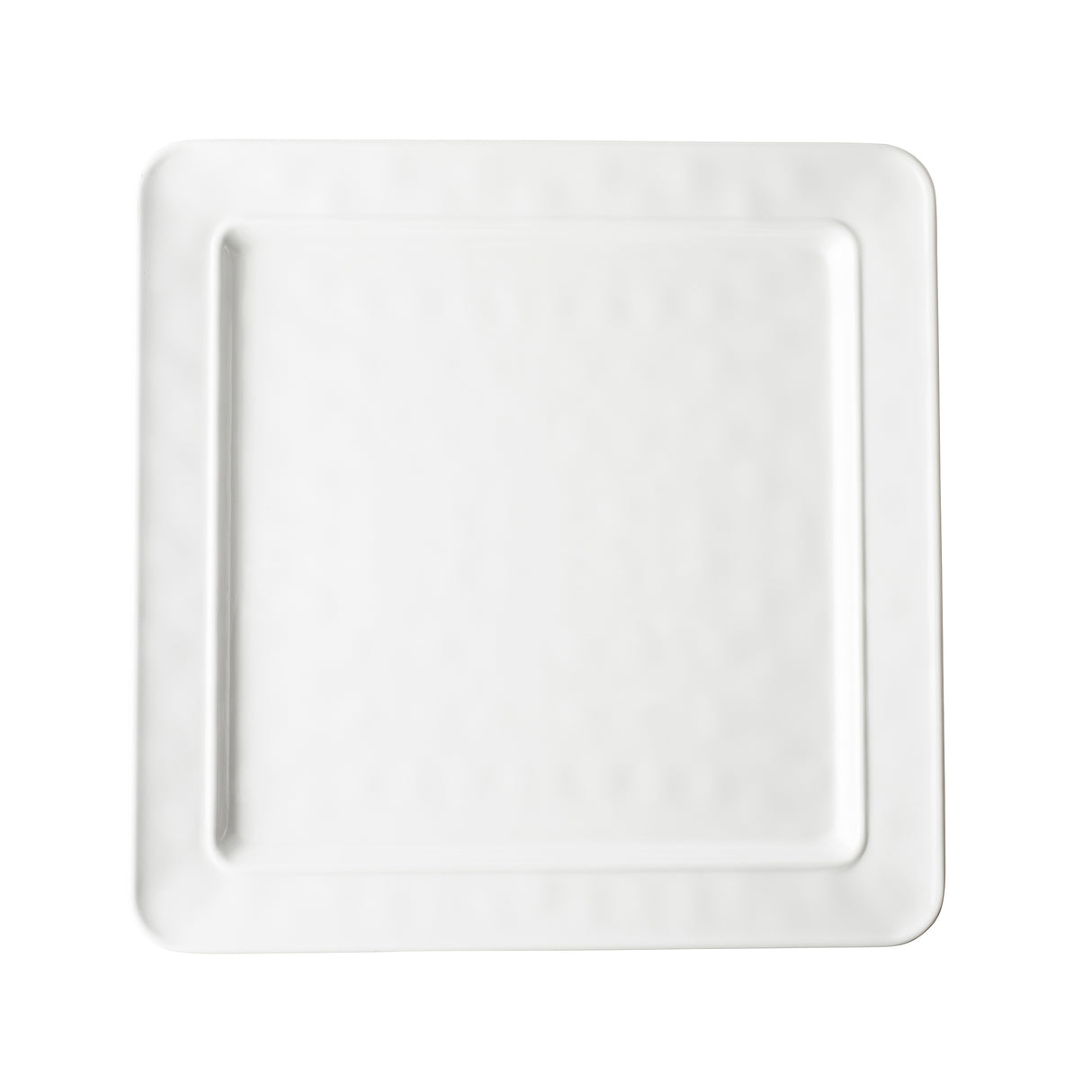 A plain, white, square ceramic plate from the Ridge Collection with slightly rounded corners and a subtle textured pattern around the rim, photographed from above on a white background. The plate’s center is smooth and unadorned.
