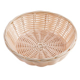 A shallow, round hand-woven basket with a natural light tan color. It features a tightly woven base, loosely woven airy sides, and a reinforced rim with a thicker band. The basket is empty.