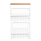 A two-tier display basket featuring a white powder coated steel frame and a light wooden handle. The open, grid-like baskets offer minimalist, modern style perfect for organizing or storing items.
