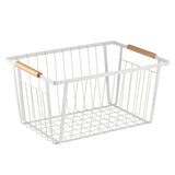 A rectangular white storage basket made of powder coated steel with a grid base and vertical sides, featuring two light brown wooden handles on opposite top edges. The basket is empty and placed against a plain white background.