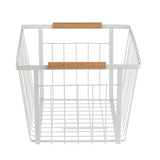 A white powder coated steel Storage Basket with an open grid design and two wooden handles on opposite sides. This rectangular basket rests on a flat surface, its wider side facing forward, against a plain white background.