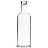 A clear, empty glass carafe with straight sides, a narrow neck, and a flat base. This 34 oz. TableCraft bottle has a cylindrical shape, is topped with a silver or metallic cap, and sits against a plain white background.