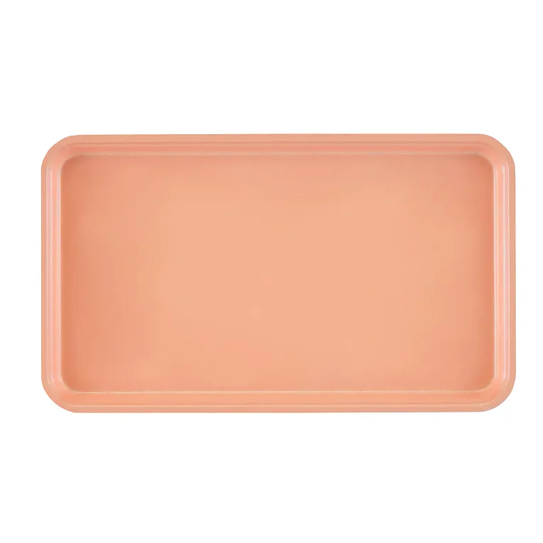 A rectangular Camtray with rounded corners, shown from above. This solid peach high-impact fiberglass tray features a slightly raised rim and is dishwasher safe. The background is light gray, and the tray is empty and unadorned.