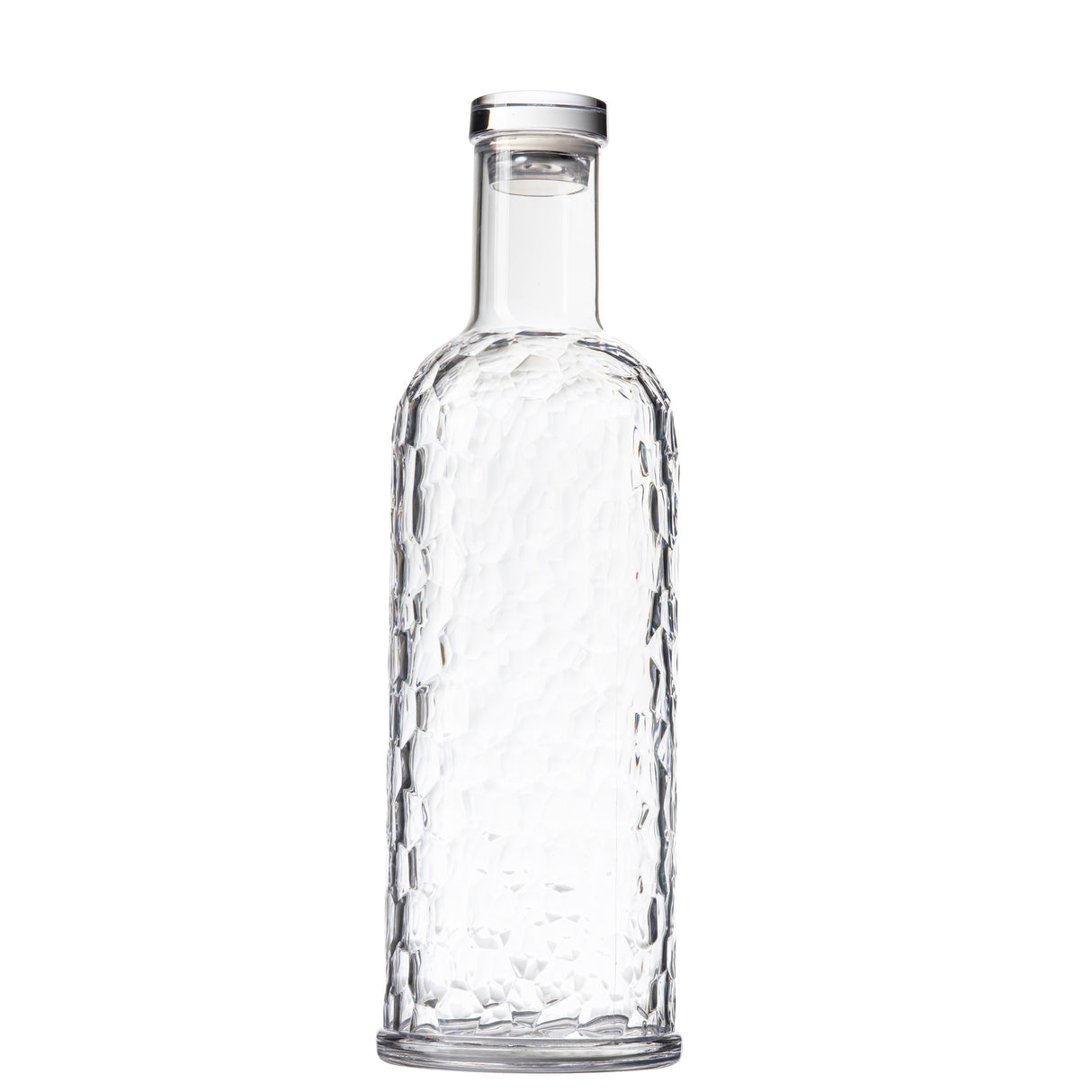 A clear glass TableCraft carafe with a tall neck and hammered, textured surface. This 34 oz bottle features a round base, smooth narrow rim, and faceted, dimpled design, standing upright against a plain white background.