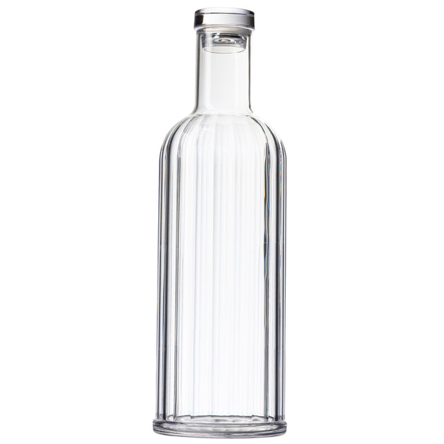 A clear, empty TableCraft glass bottle with a cylindrical shape, straight sides, and a slightly rounded shoulder. This 34 oz carafe has a narrow neck sealed with a round, flat, silver-colored cap against a plain white background.