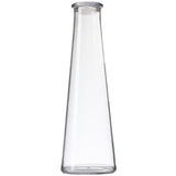 A clear, empty, 34 oz tall glass carafe with smooth sides tapers gently inward from a wide base to a narrow, round opening at the top. This elegant TableCraft vessel stands upright against a plain white background.