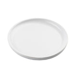 A plain, round white ceramic plate from the Terra Collection serving plate line is shown from a slightly angled top view. The plate has a smooth surface, a subtle rim, and no visible patterns or decorations against the white background.