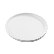 A plain, round white ceramic plate from the Terra Collection serving plate line is shown from a slightly angled top view. The plate has a smooth surface, a subtle rim, and no visible patterns or decorations against the white background.