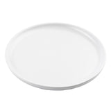 A plain, round, white Terra Collection Serving Plate with a slightly raised rim is photographed on a white background. The plate is empty and viewed from a slight angle, highlighting its minimalistic and clean design.