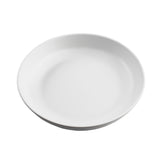 A plain, white, round ceramic plate is shown against a white background. With gently curved edges and no patterns, it matches the minimalist style found in TableCraft Products' Terra Collection serving bowl.
