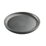 A round, shallow, dark gray TableCraft Terra Collection Serving Plate with a slightly raised edge and smooth, matte, speckled surface sits on a white background. The melamine serving plate appears sturdy and minimalistic in design.