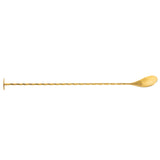 A Gold Bar Spoon with a twisted handle, flat disc on one end, and rounded spoon on the other, crafted from stainless steel. Displayed horizontally on a white background.