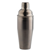A 24 oz stainless steel cocktail shaker stands upright against a plain white background. The shaker features a smooth, metallic surface with a cap and a slightly wider body that tapers gracefully towards the base.