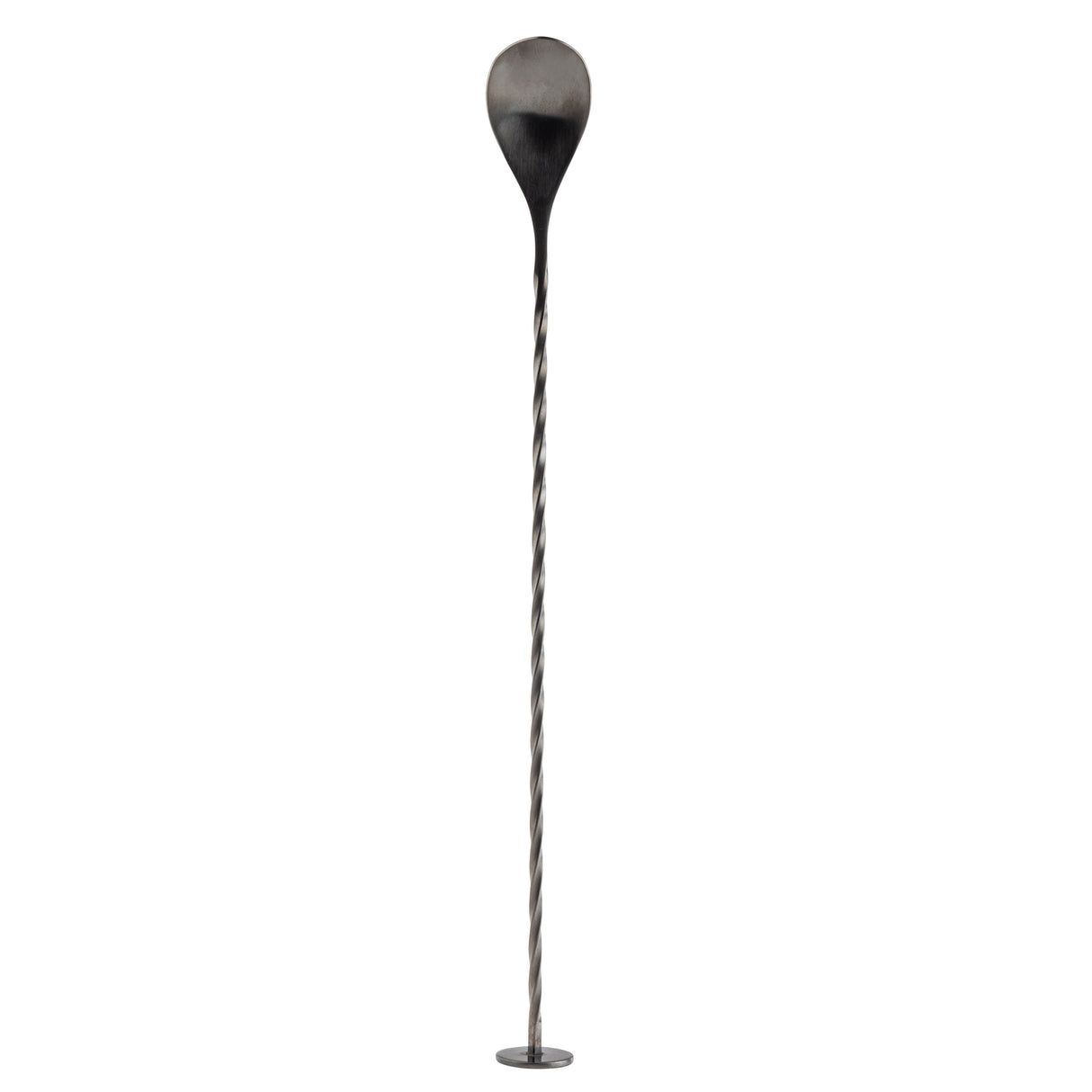 A long, thin stainless steel Bar Spoon with a twisted shaft stands upright on a small round base. The top features a large, teardrop-shaped paddle, blackened at the edges and fading to metallic grey. The background is plain white.