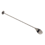 A long, slender TableCraft Bar Spoon with a twisted handle. Crafted from stainless steel, it features a small flat disc at one end and a shallow oval spoon at the other—perfect for mixing cocktails and stirring drinks. The background is plain white.