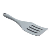 A light gray, plastic slotted spatula with an NSF-certified design features a slightly angled handle and three rectangular slots in the flat blade. The handle has a hole near the end for hanging. The spatula is positioned on a white background.