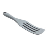 A gray, slotted silicone kitchen utensil with a curved handle and three long slots in the flat head, designed for flipping or serving food. The handle has a small hole for hanging. This spatula is shown on a white background.